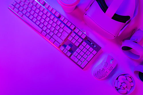 Keyboard with mouse and headphones on desk