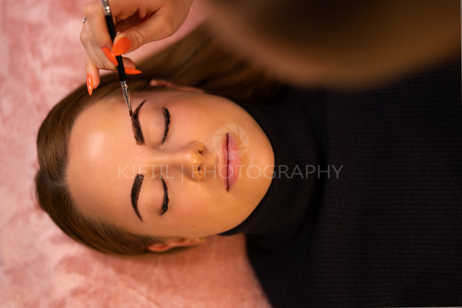 Cosmetologist Applying Dye On Female Customer's Eyebrow