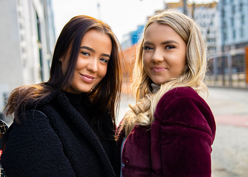 Close-up Portrait Of Happy and Beautiful Young Women Friends In City
