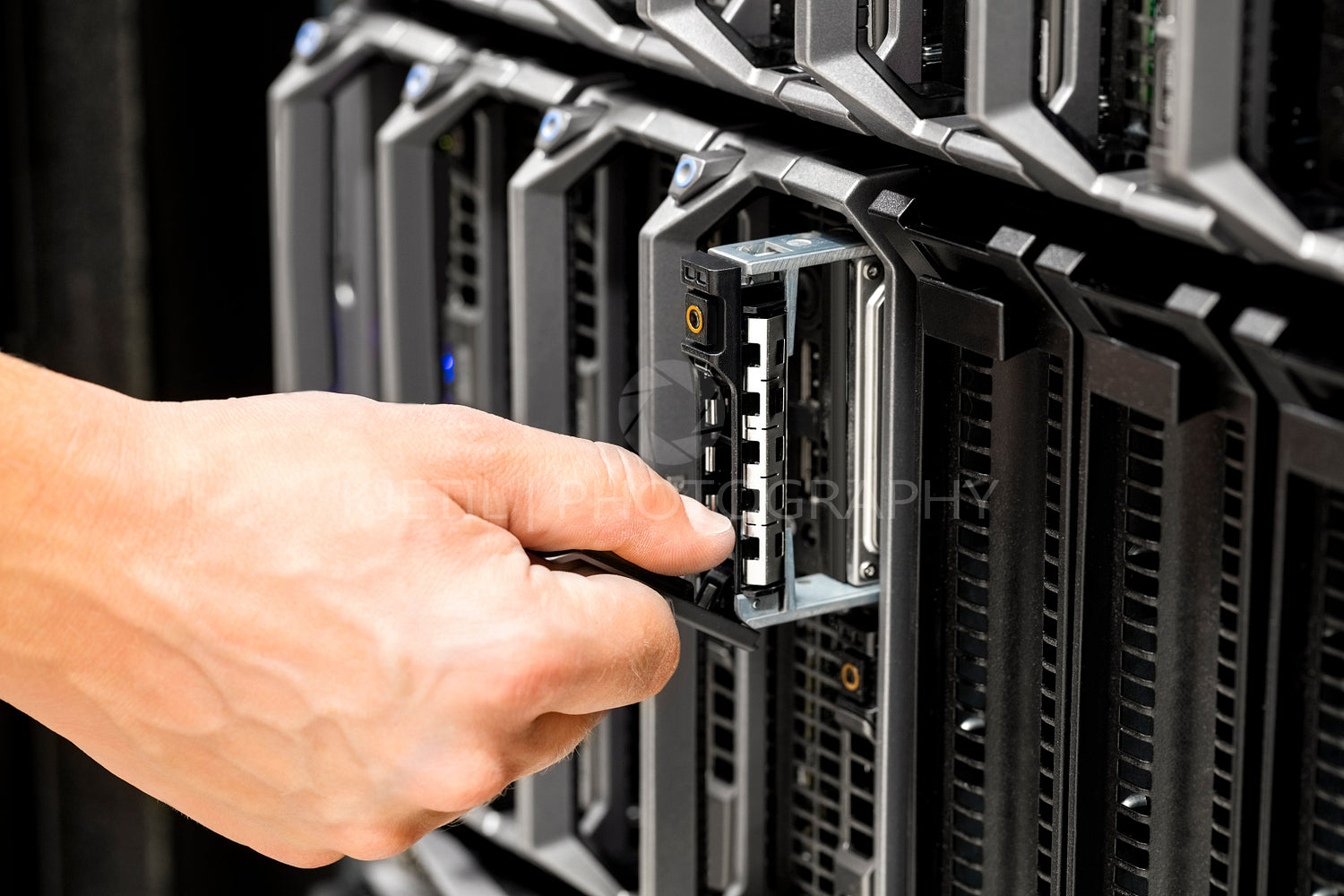 IT Technicians Repairing Harddrive on Server At Data Center
