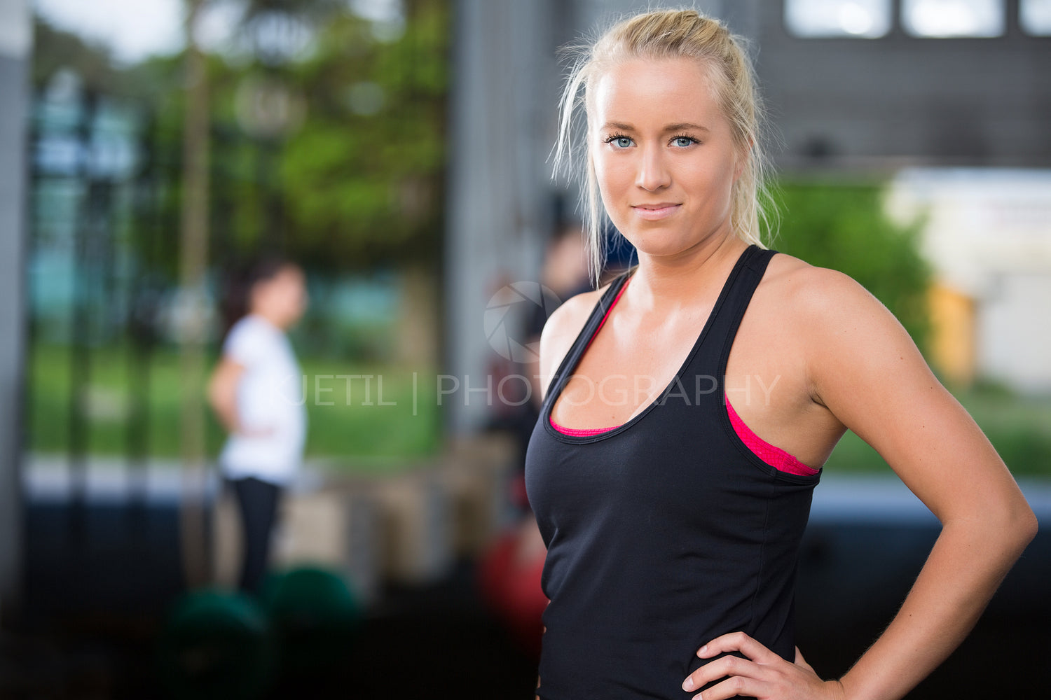 Attractive blonde woman at fitness gym