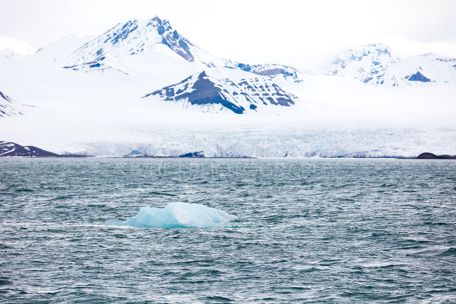 Floating sea ice near a massive glacier in the arctic
