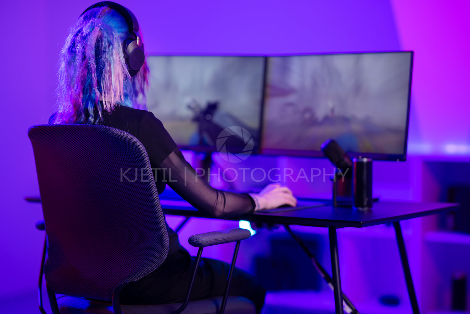 E-sport gamer girl plays first-person shooter online video game on PC