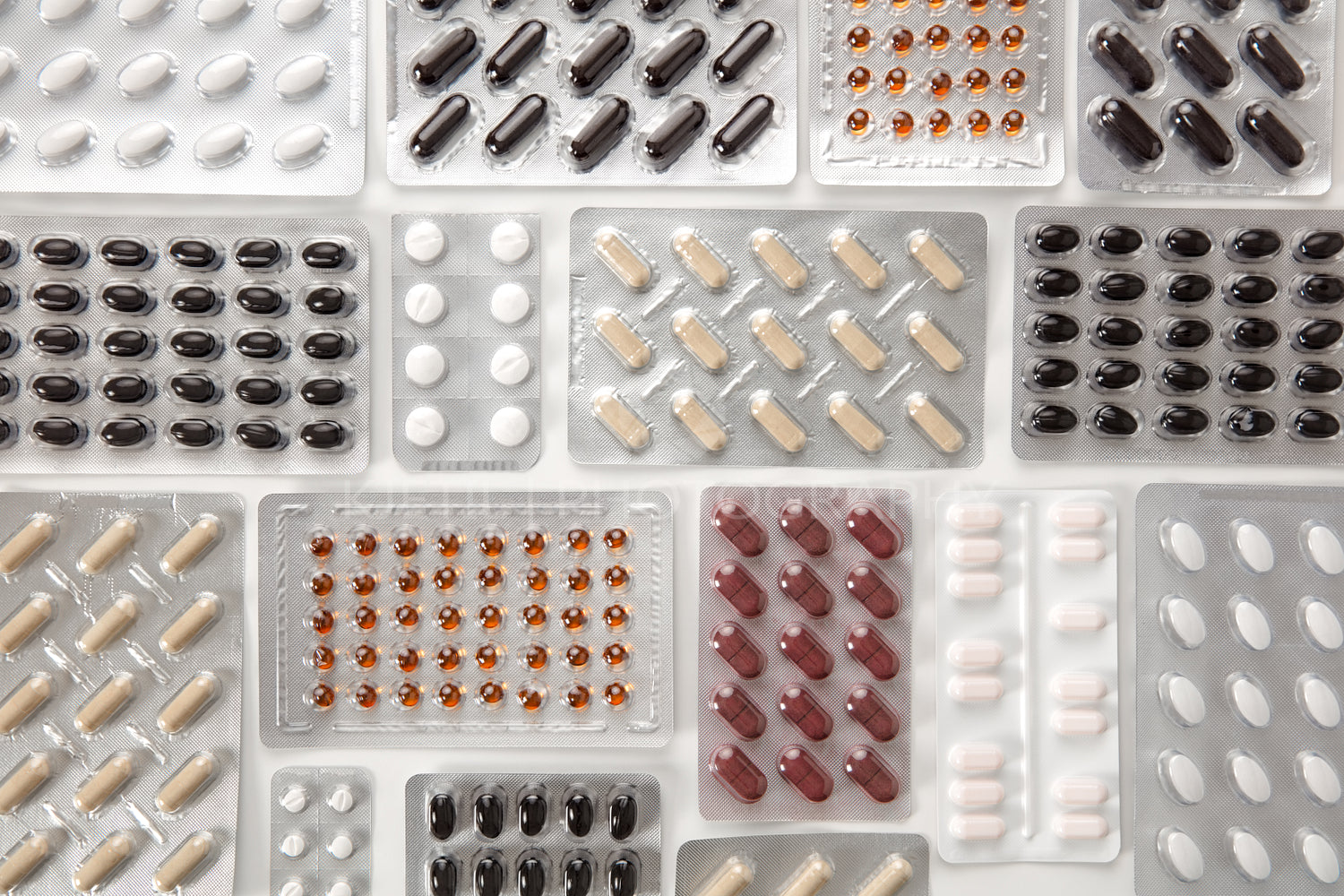 Various Pills In Blister Packs On Table