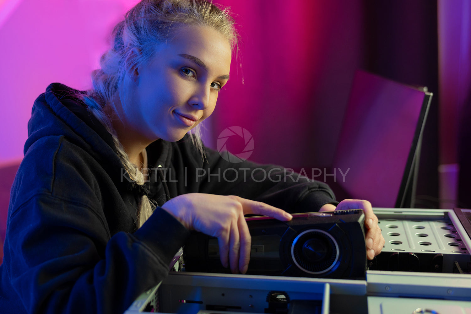 Close-up of Gamer Girl Installing New GPU Video Card in Her Gaming PC