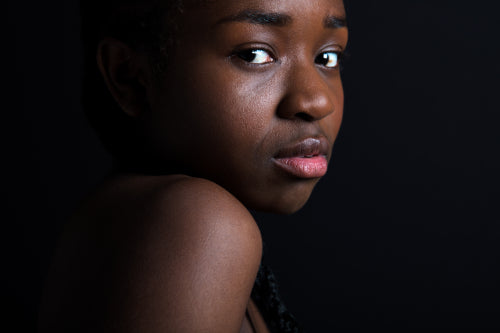 Confident Female Model Over Black Background