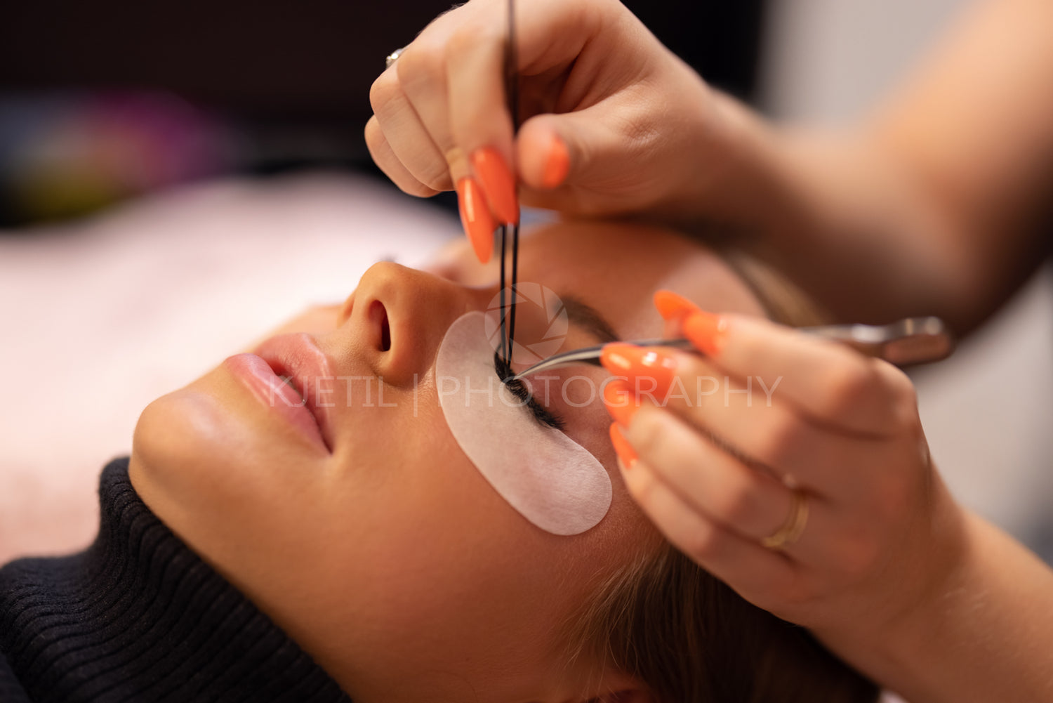 Hands Of Specialist Using Tweezers For Applying False Eyelashes