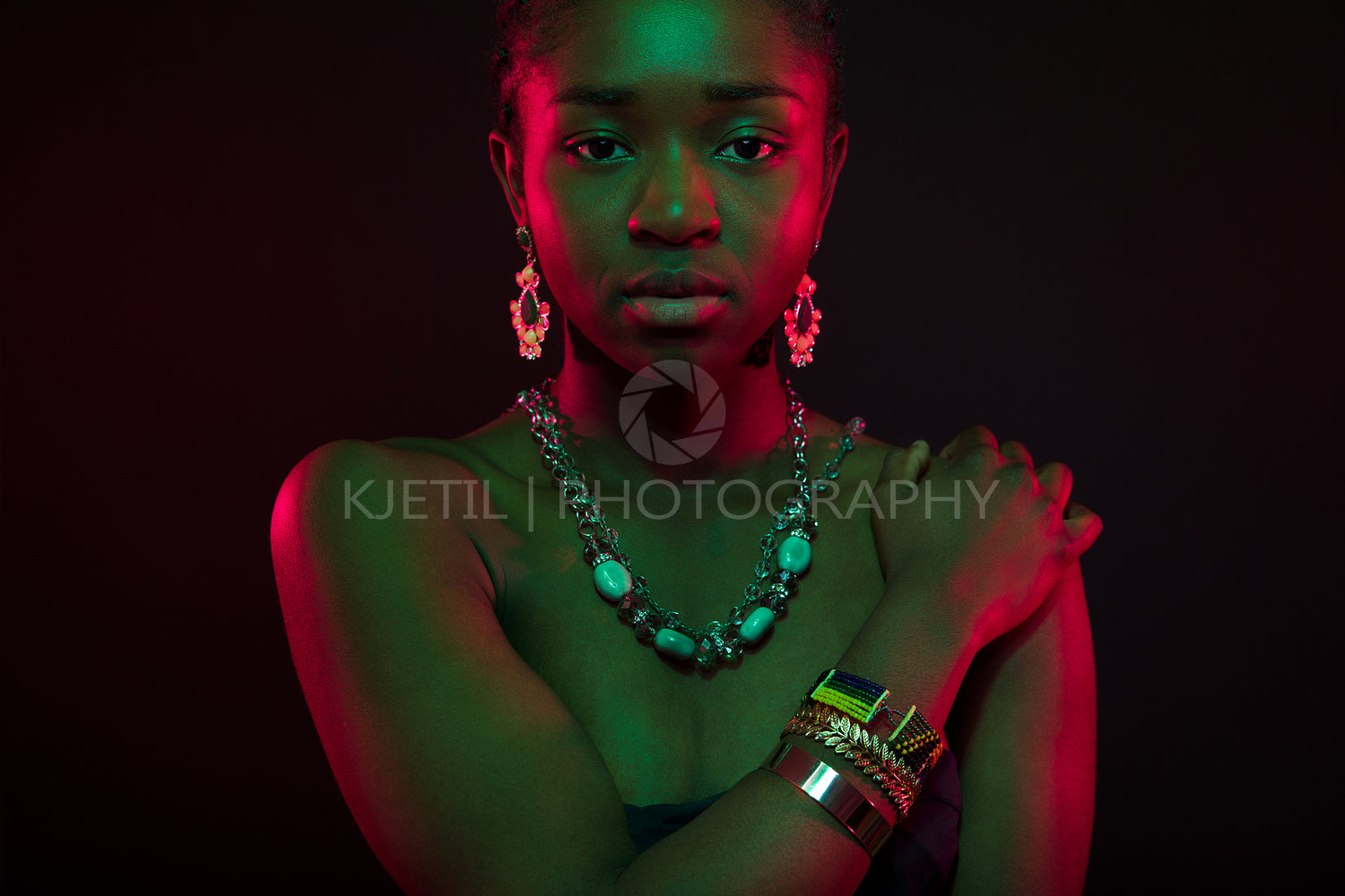 Sensuous Woman Wearing Jewelry Over Black Background