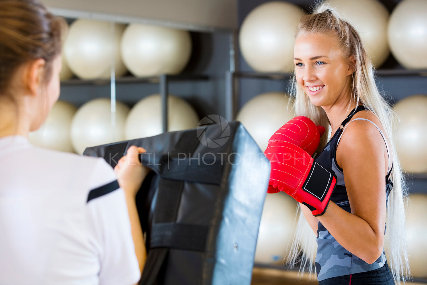 Female Boxer Practicing In Health Club