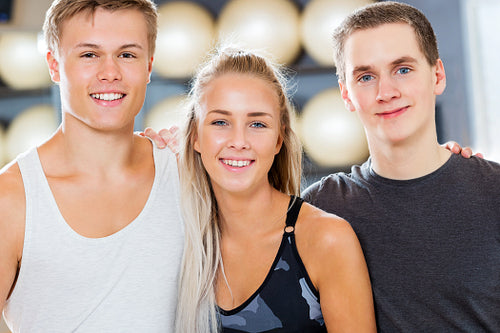 Close-up of Confident Male And Female Friends Smiling In Gym