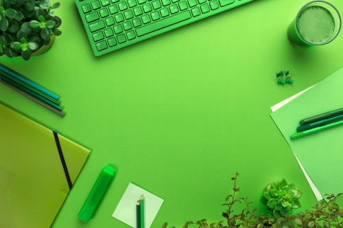 Environmental concept of a green office desk with supplies