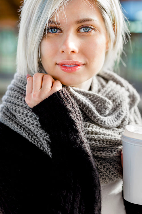 Beautiful Woman Holding Disposable Coffee Cup At Train Station