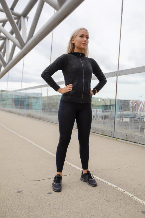 Pretty Woman in Black Workout Wear Standing At Modern Bridge In City