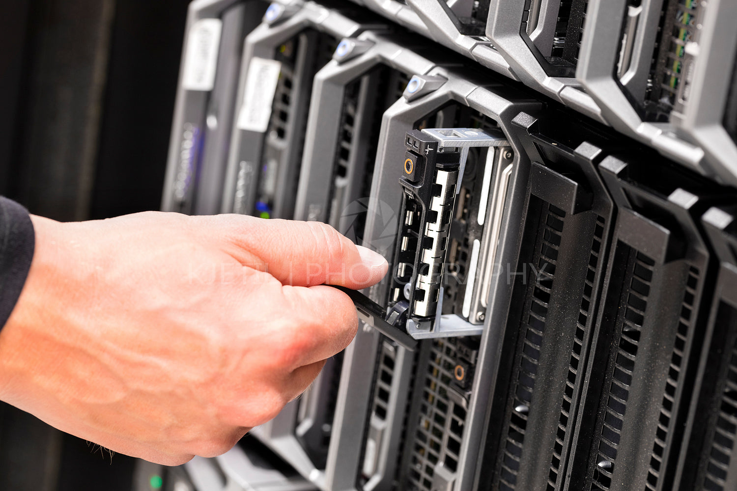 IT Technicians Repairing Harddrive on Server At Data Center