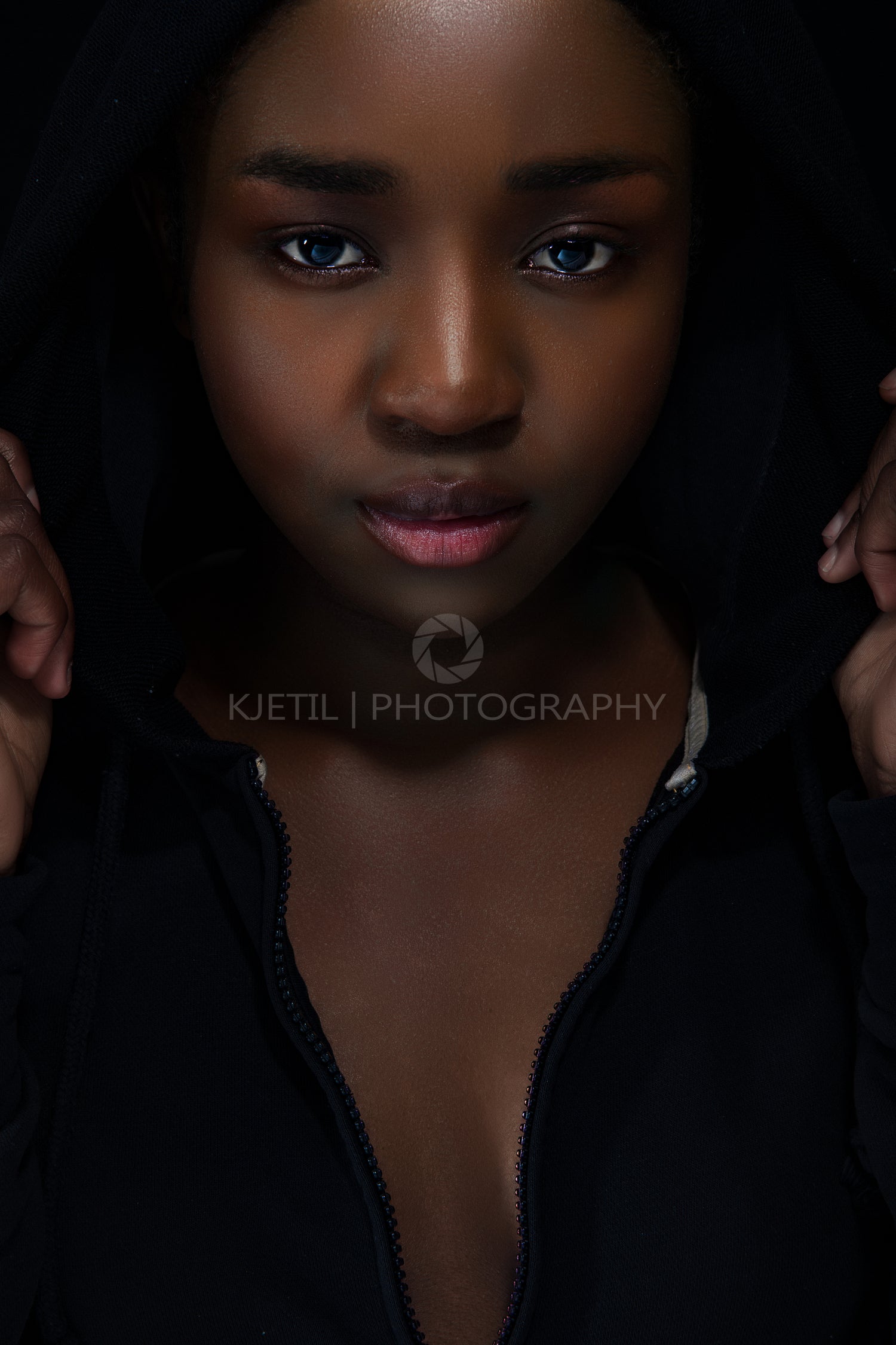 Cool and confident woman with dark skin and attitude wearing hoodie