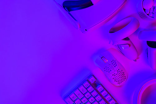 Modern gaming accessories on purple desk