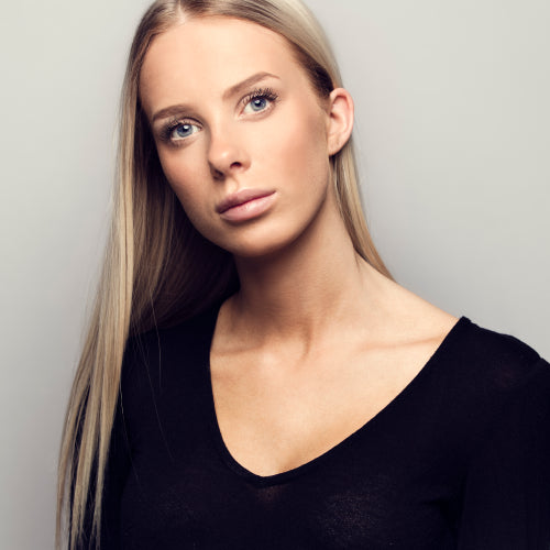 Portrait of a casual blonde woman in black top