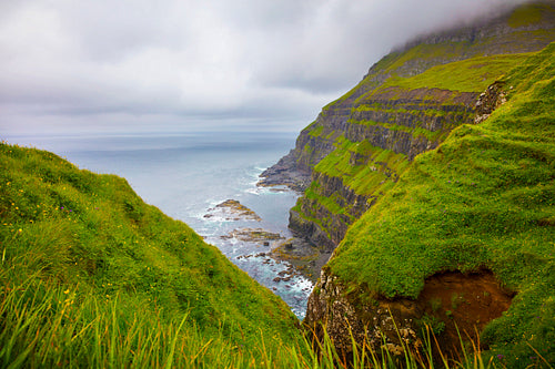 Dramatic landscape on a cloudy day at Faroe Islands