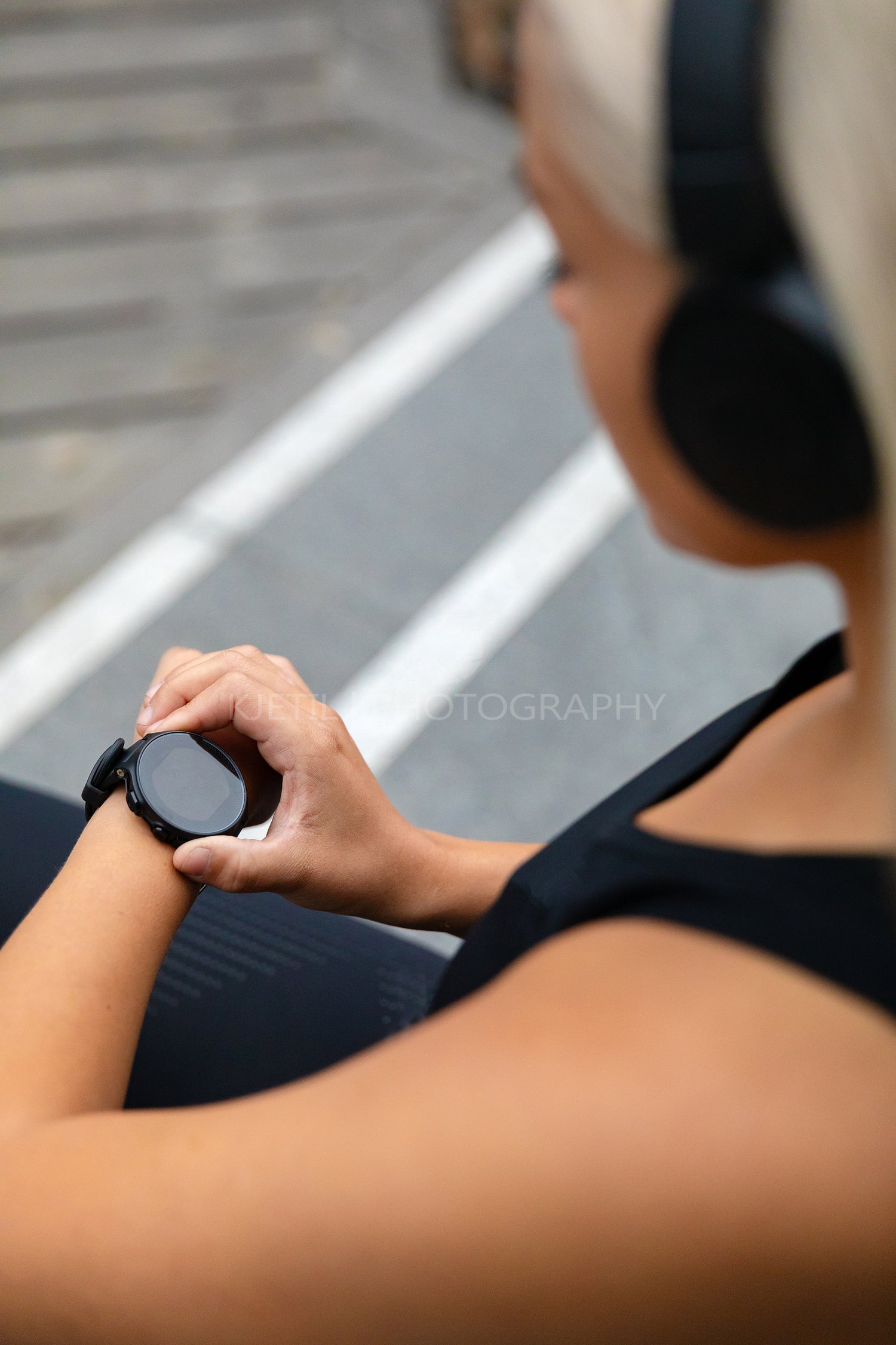 Fit woman setting up the fitness smart watch for running.