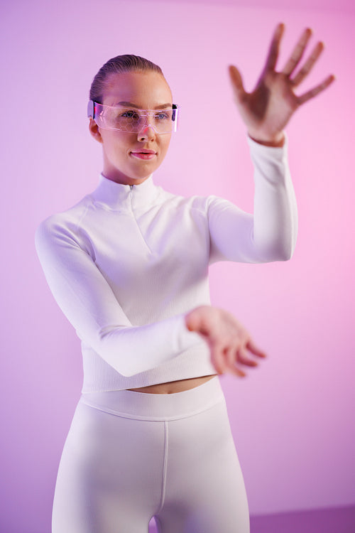 Woman in smartglasses standing in studio