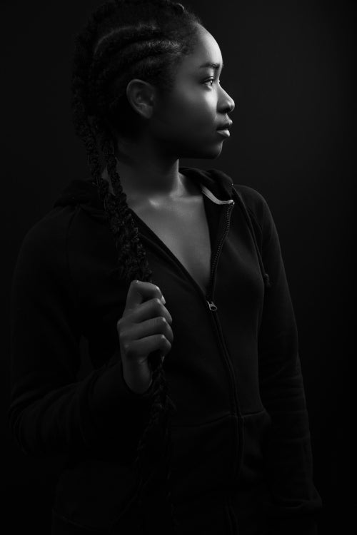 Confident woman with dark skin and cool attitude wearing hoody