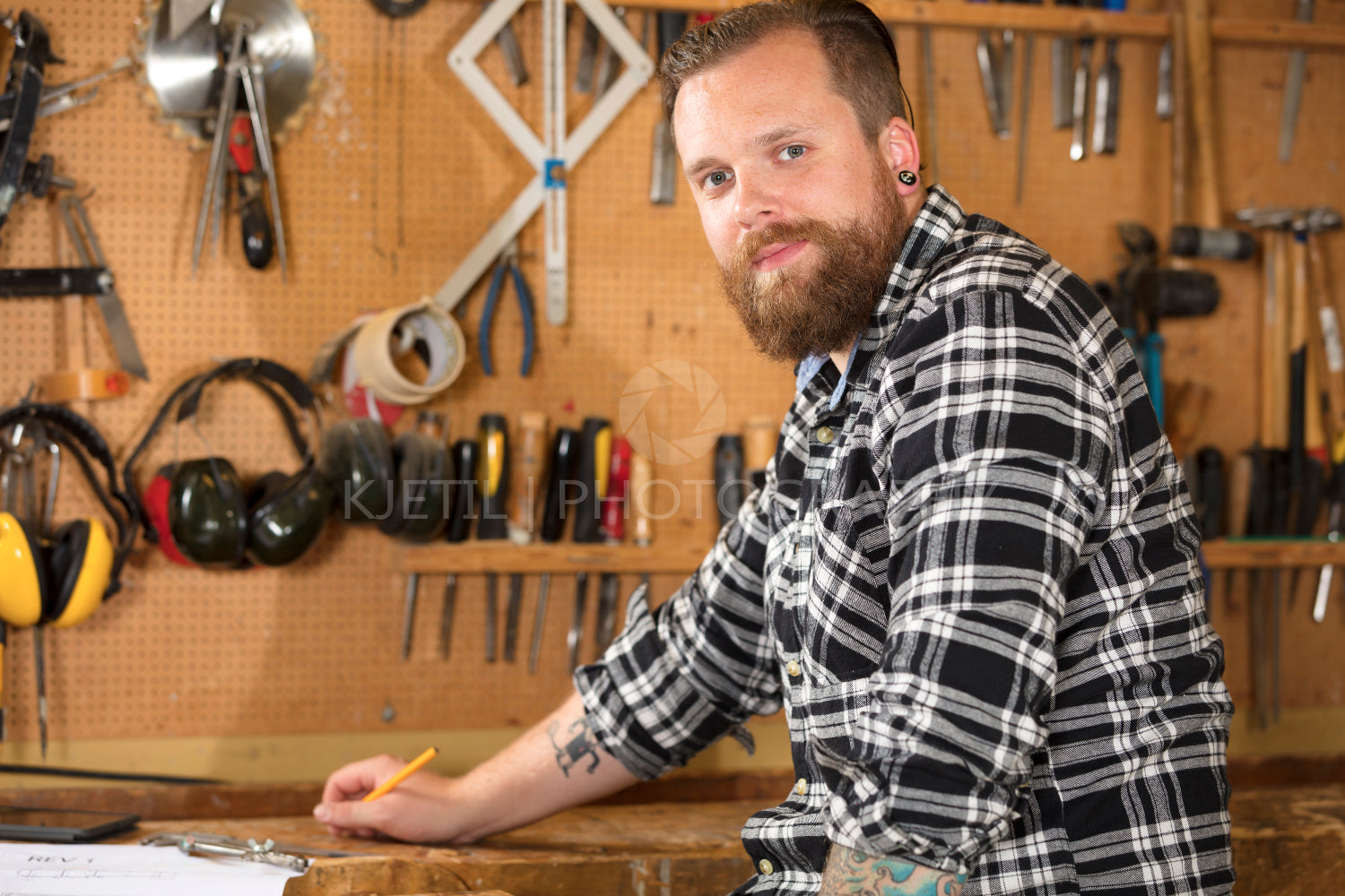 Environmental portrait of a carpenter in workshop