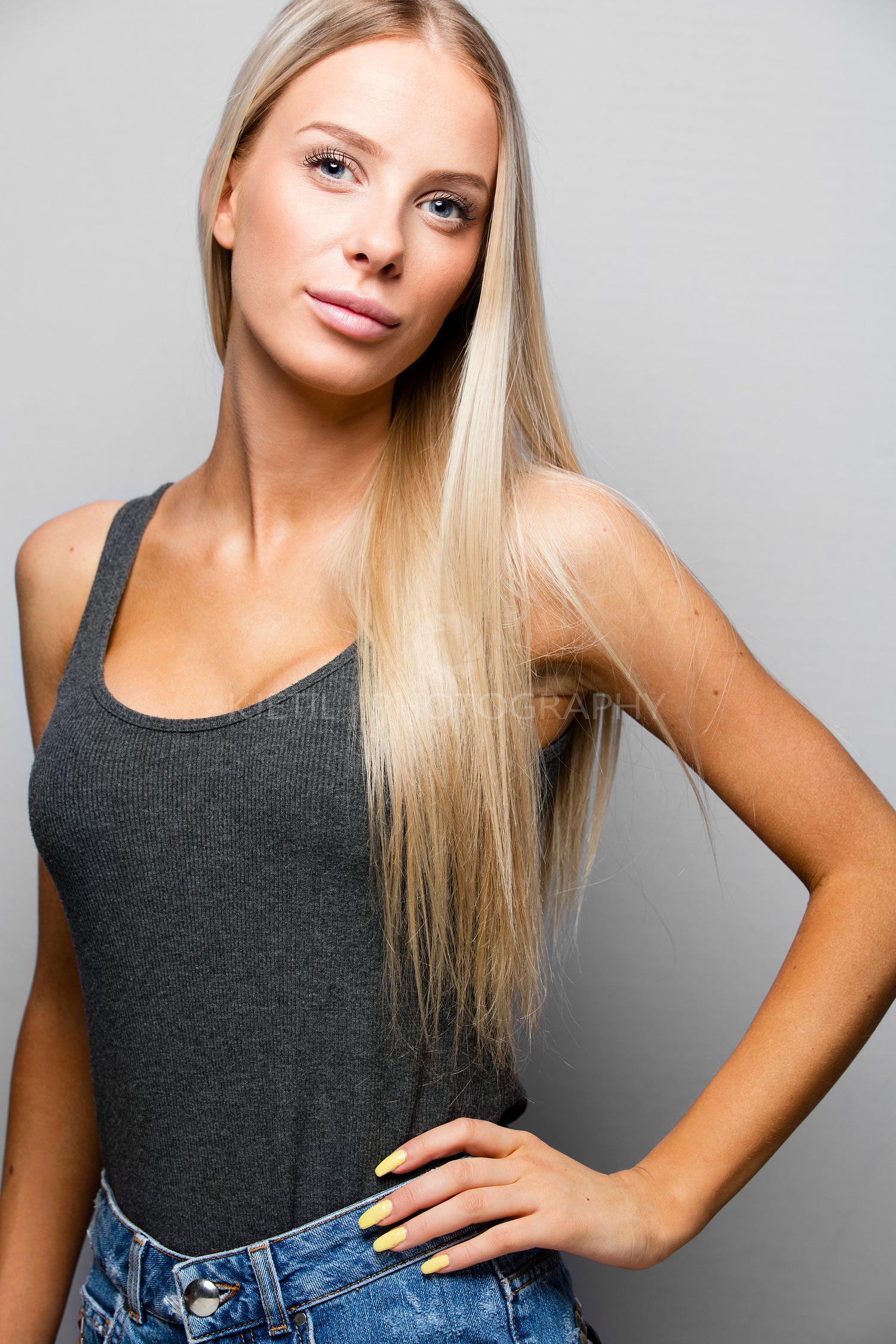Fashion portrait of a confident and blonde young woman