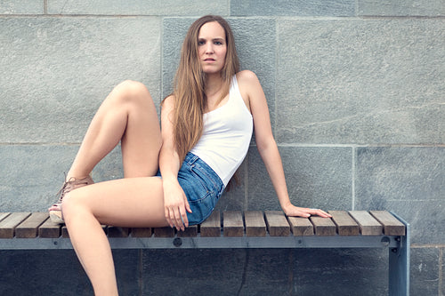 Attractive woman sitting on bench outdoor