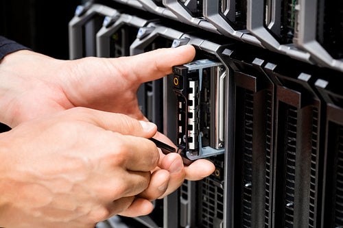 IT Technicians Hands Working On Server At Data Center