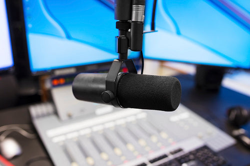 Microphone in modern radio station broadcasting studio