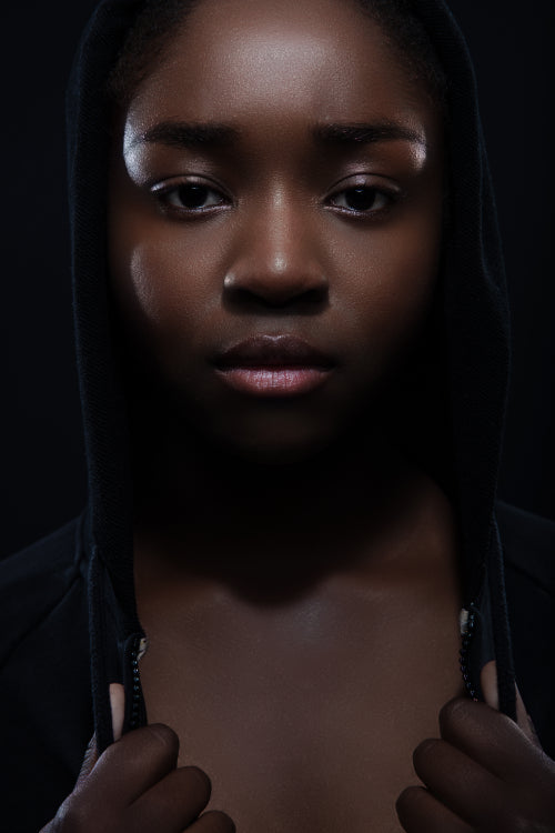 Cool and serious woman with dark skin and attitude wearing hoodie