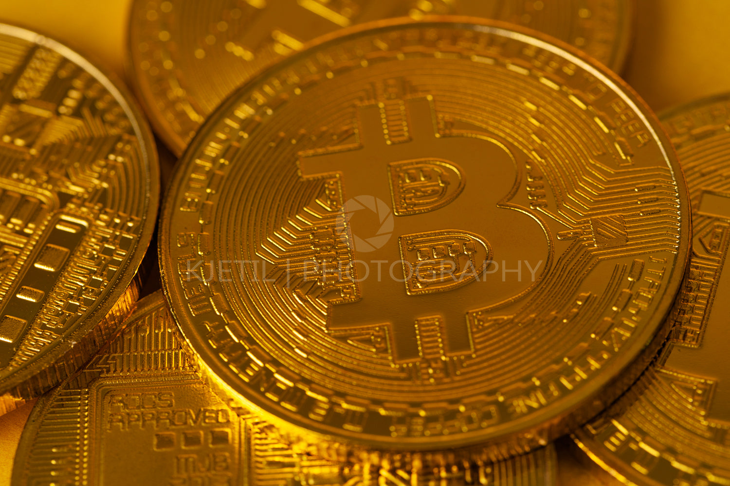 Top view closeup photo of many gold bitcoins