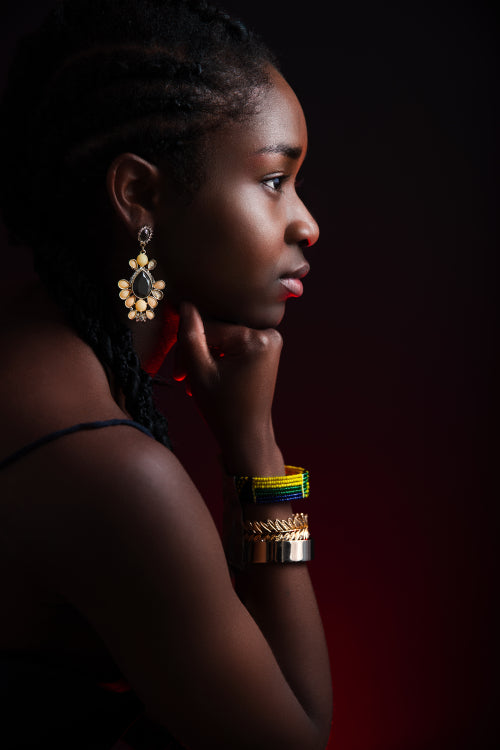Colorful and dark side view portrait of native african woman
