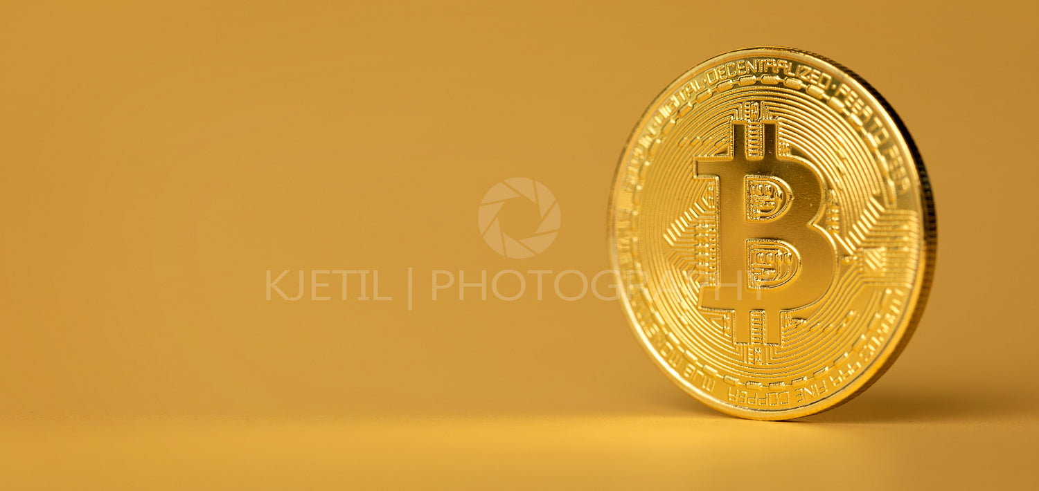 Bitcoin Crypto Currency Coin Standing On Golden Background