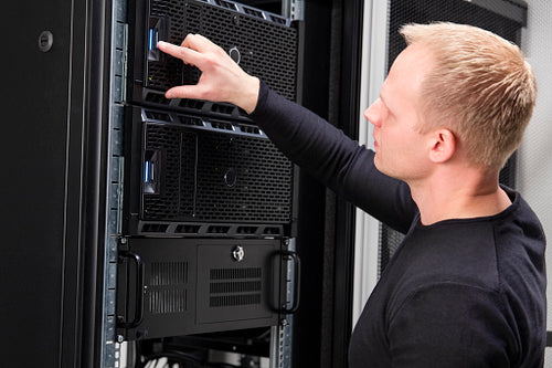 It consultant working with servers in datacenter
