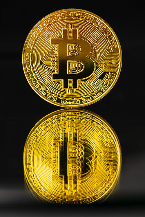 Gold Bitcoin With Reflection On Black Background