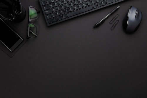Office Equipment With Computer Keyboard And Mouse On Gray Desk