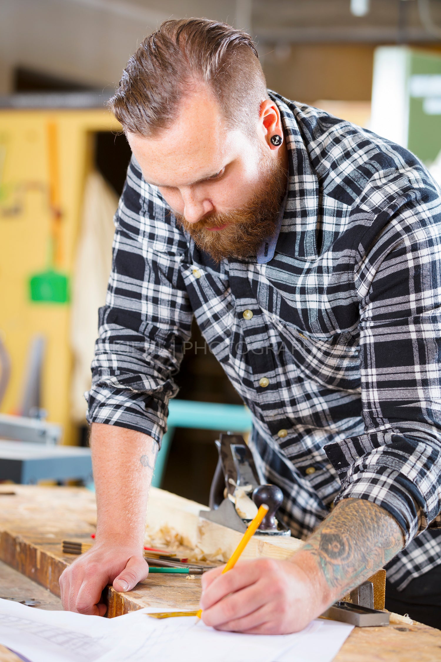 Carpenter plans work and notes at project drawings