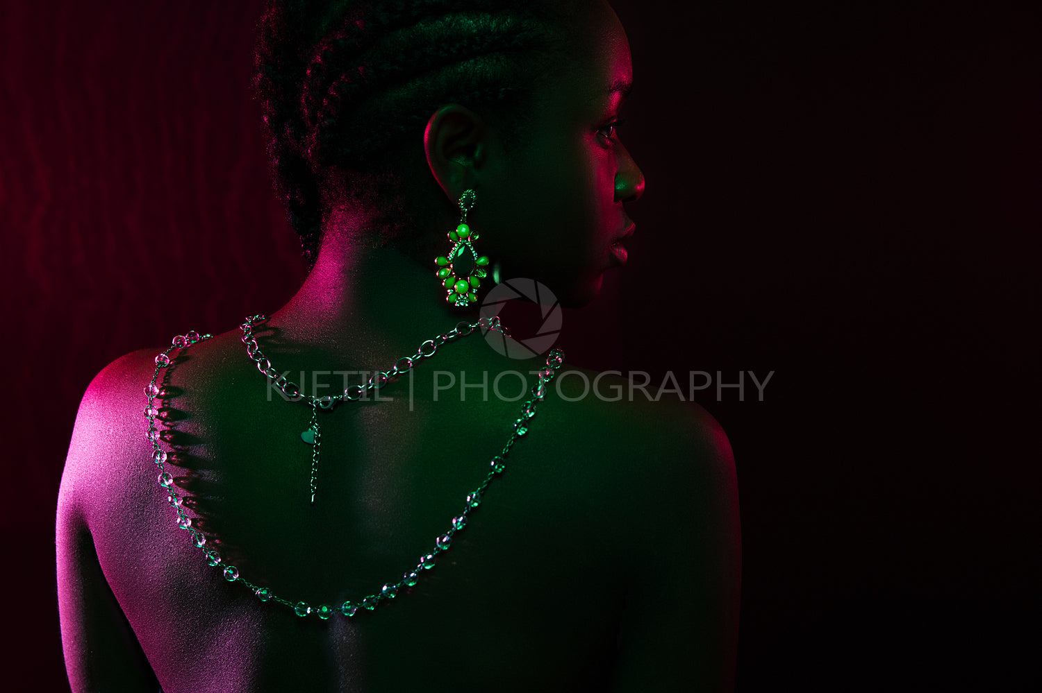 Colorful and creative portrait of african womans back with dark skin