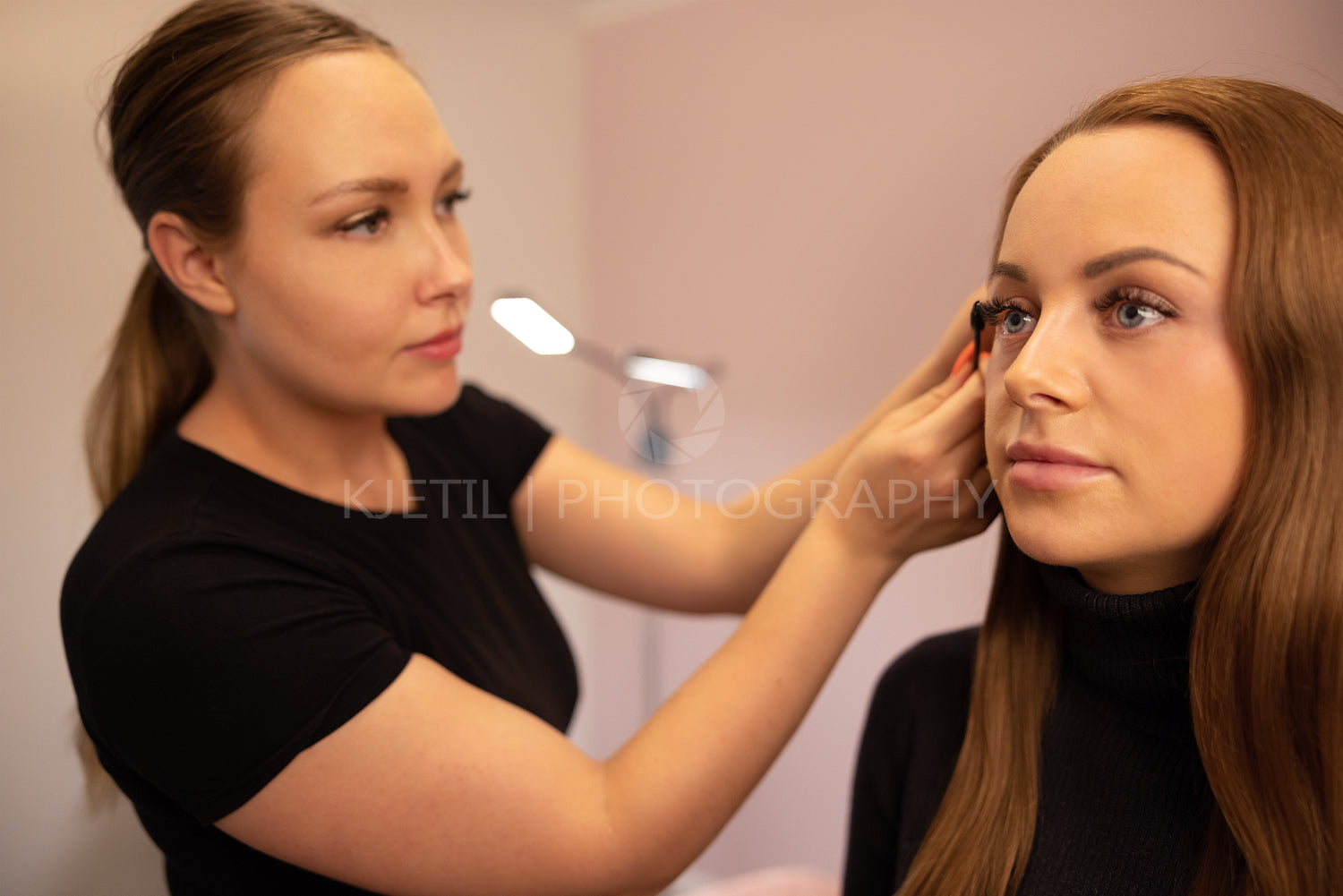 Female Specialist Using Mascara On Customer's False Eyelashes