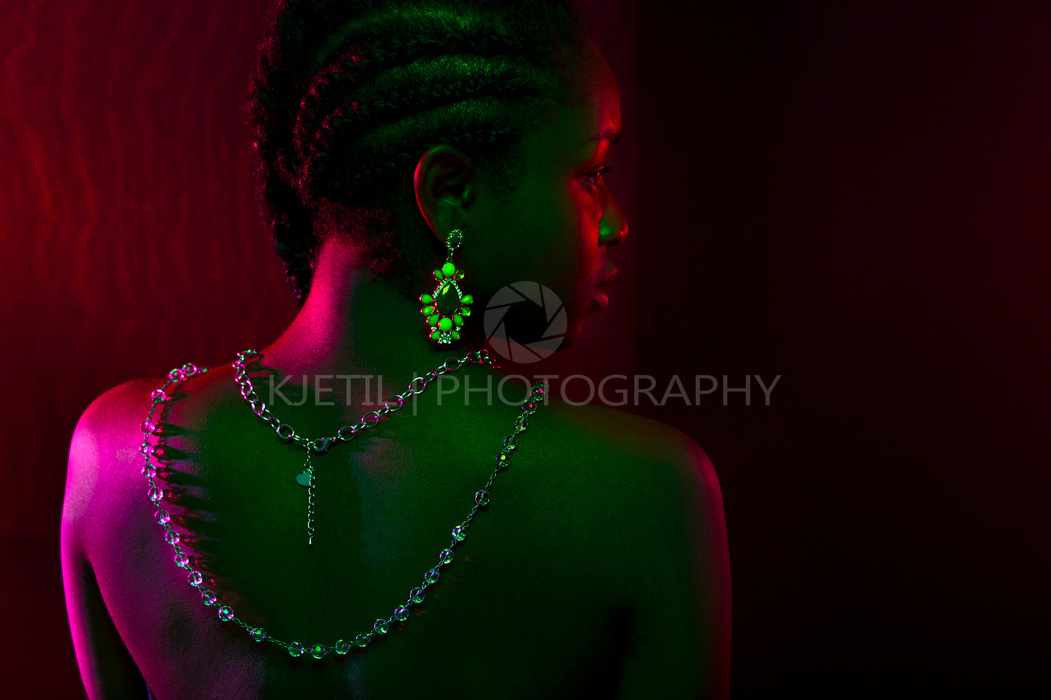 Colorful and creative portrait of african womans back with dark skin