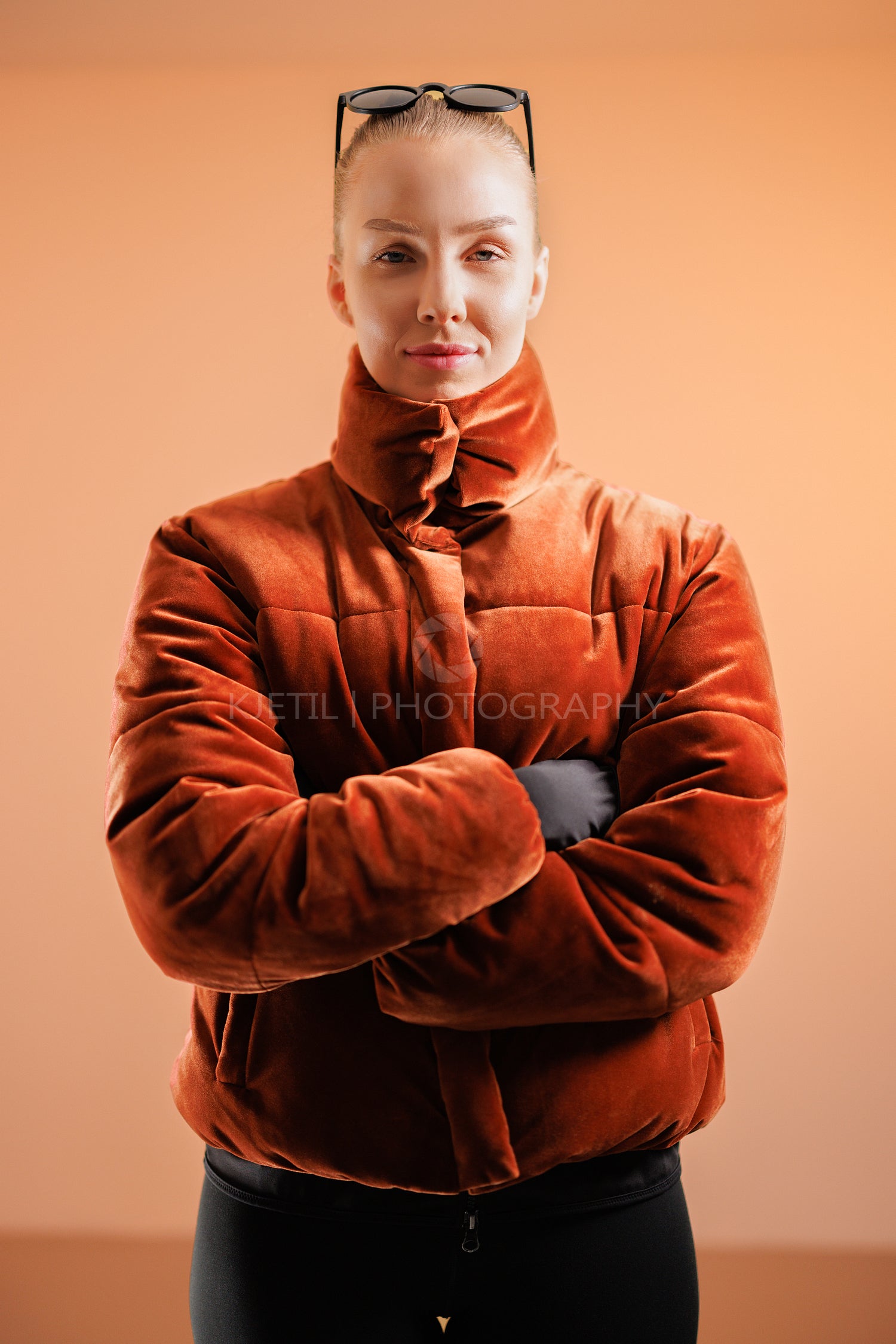 Confident young woman with arms crossed