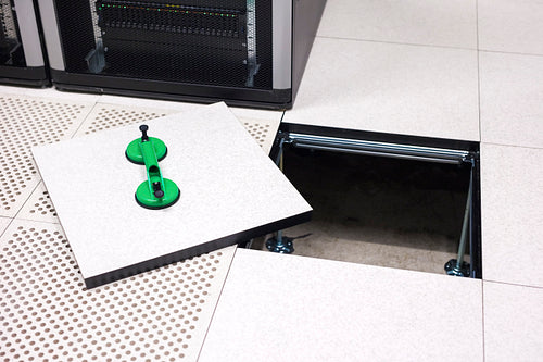 Lifted Datacenter Floor Tile With Vacuum Suction Cups In Datacenter