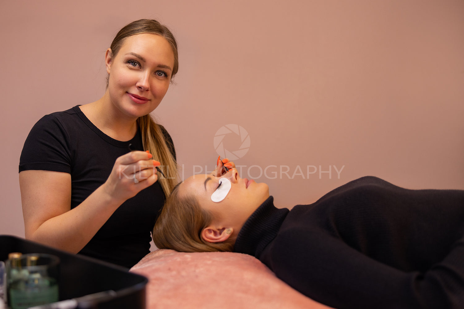 Confident Smiling Expert By Female Customer During Eyelash Extension