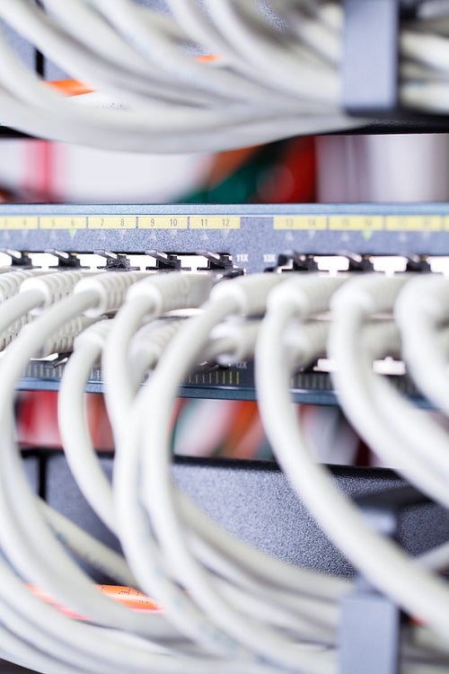 Close-up of gigabit network switch and cables in datacenter