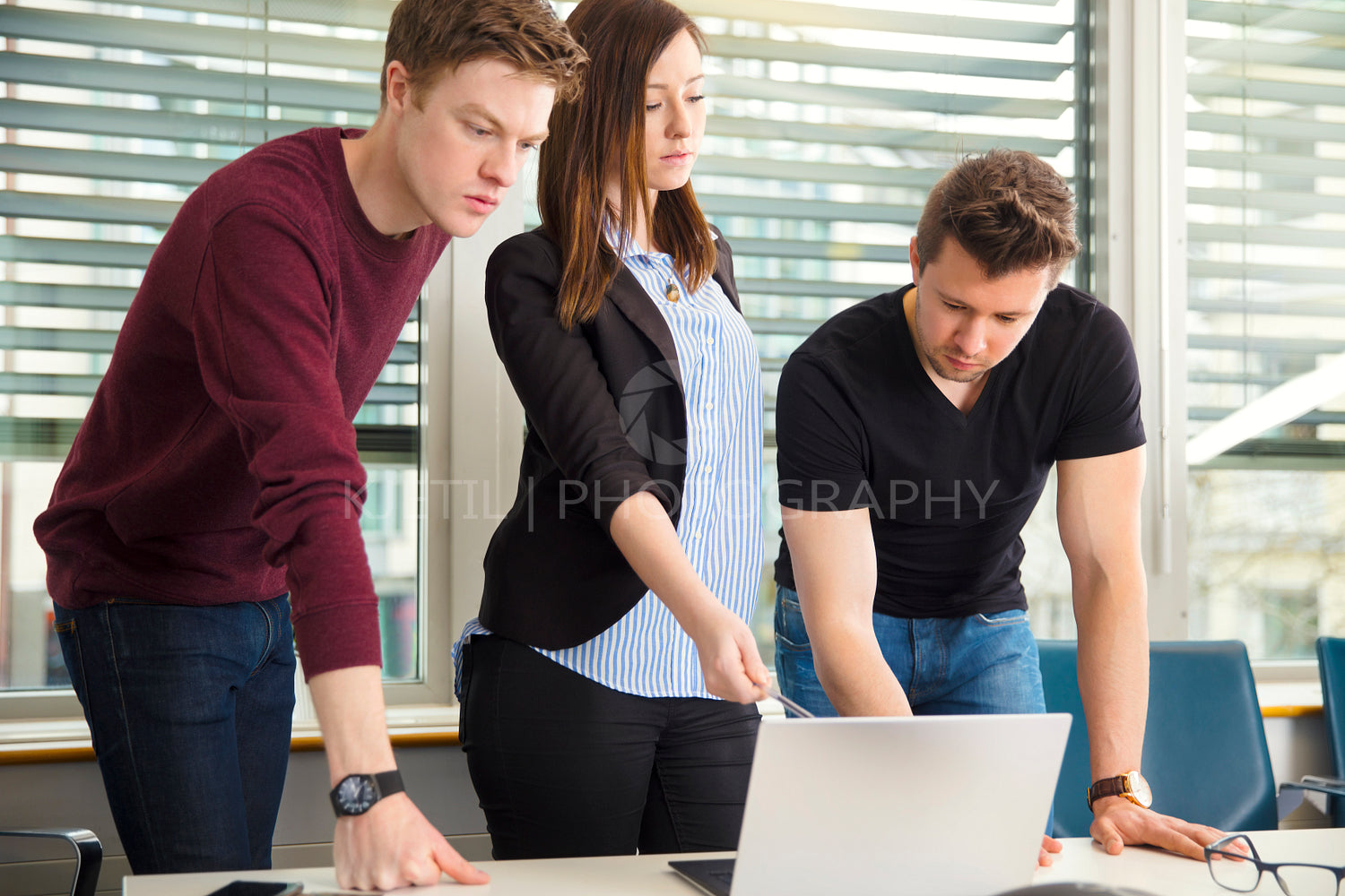Business People Using Laptop In Office