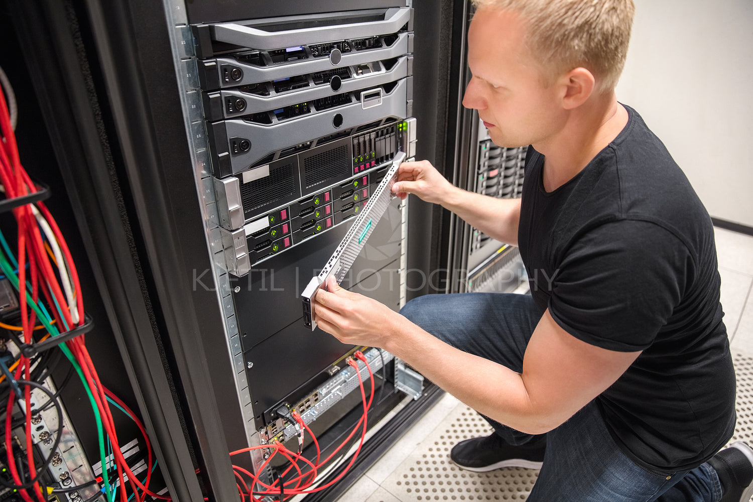 Engineer Checking Computer Server In Datacenter