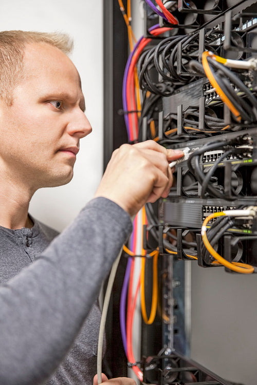 IT consultant working with network switches