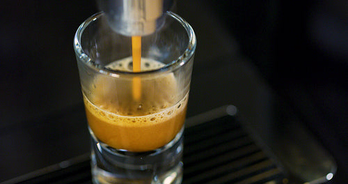 High angle view of strong espresso making at exclusive coffee machine