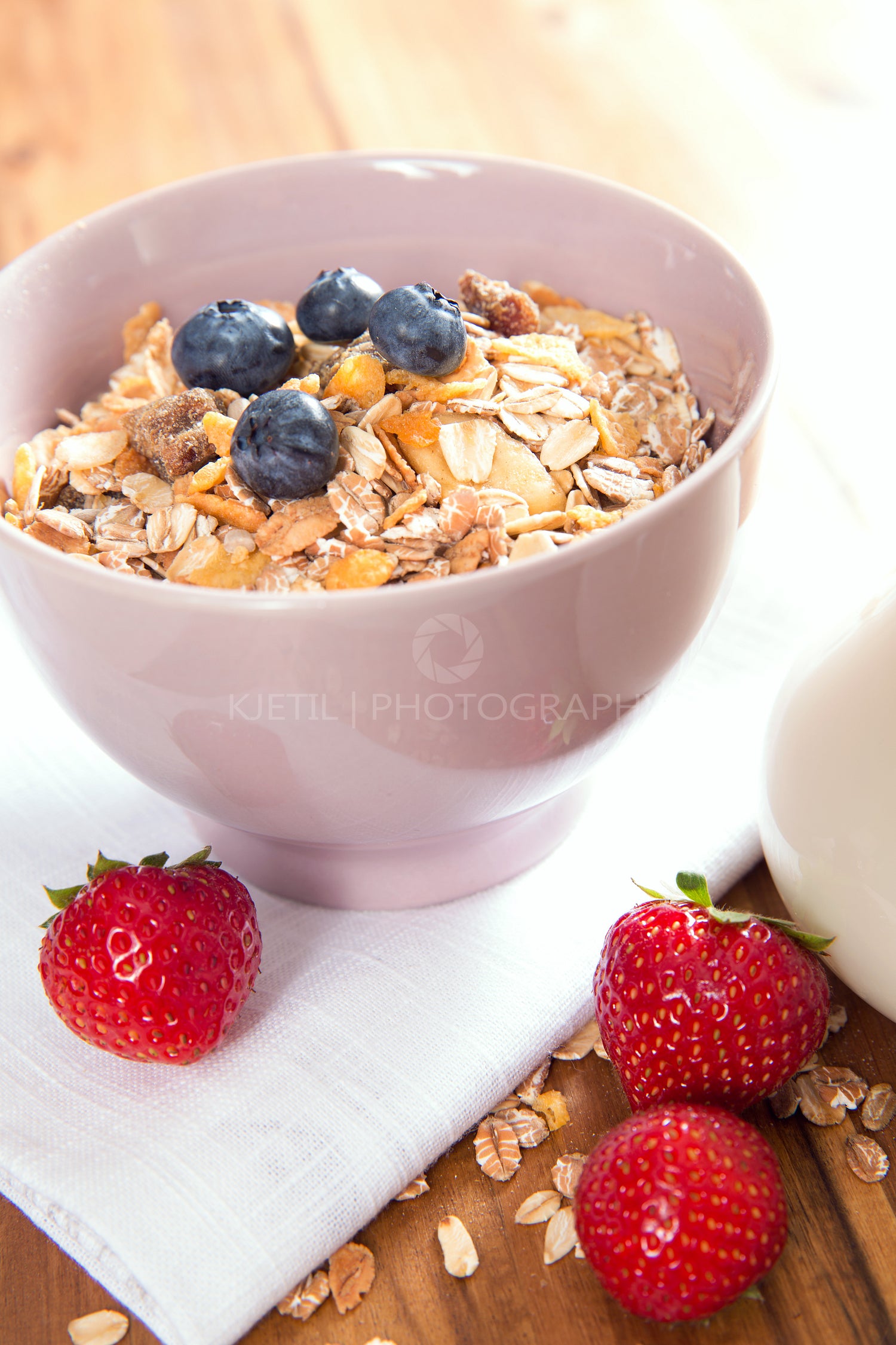 Healthy muesli with fresh berries and milk